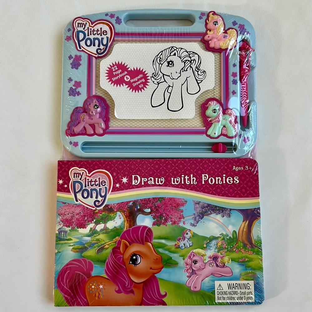 My Little Pony hard cover book and drawing pad.